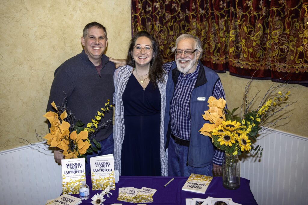 Jessica with her dad and brother at Isis Books launch event