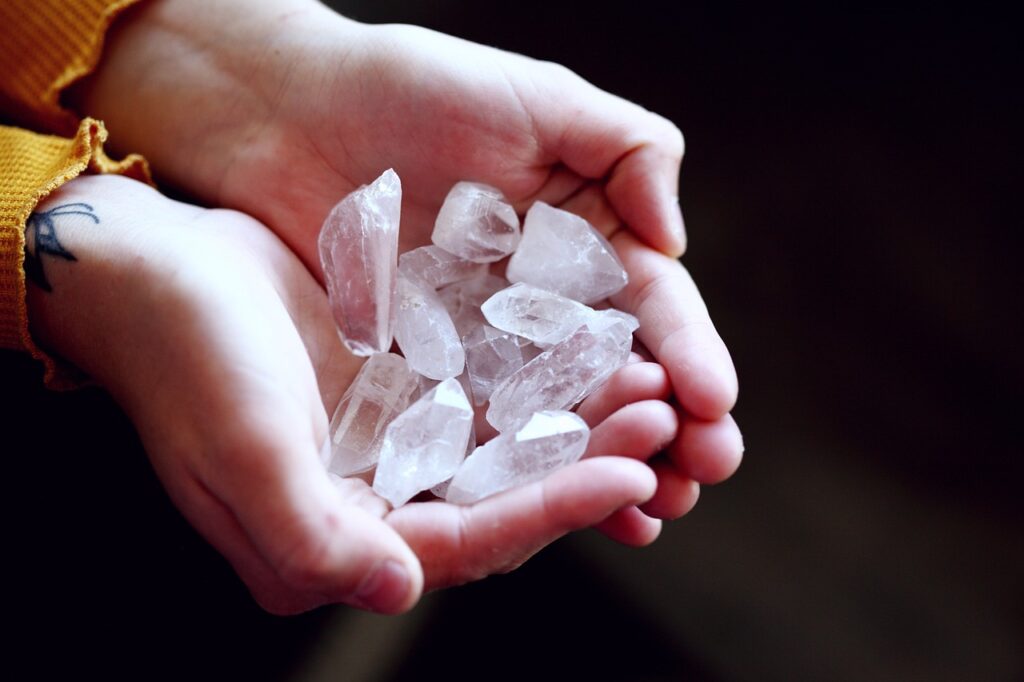 hands holding crystals for reiki